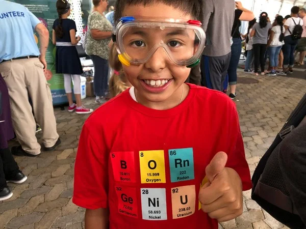 student at outreach event