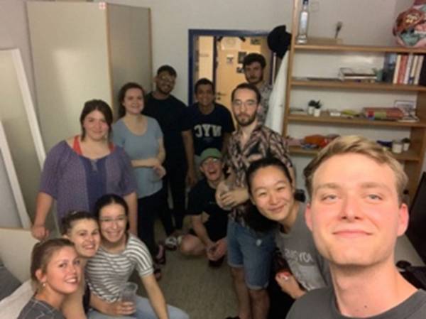 People gathered in room for a selfie