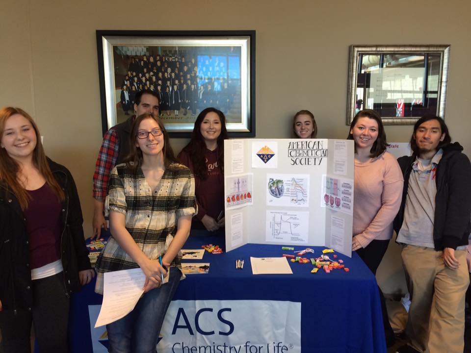Chapter members host a table at Baptist College's annual heart fair.