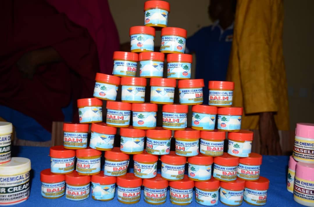 Containers of balm stacked up in a pyramid